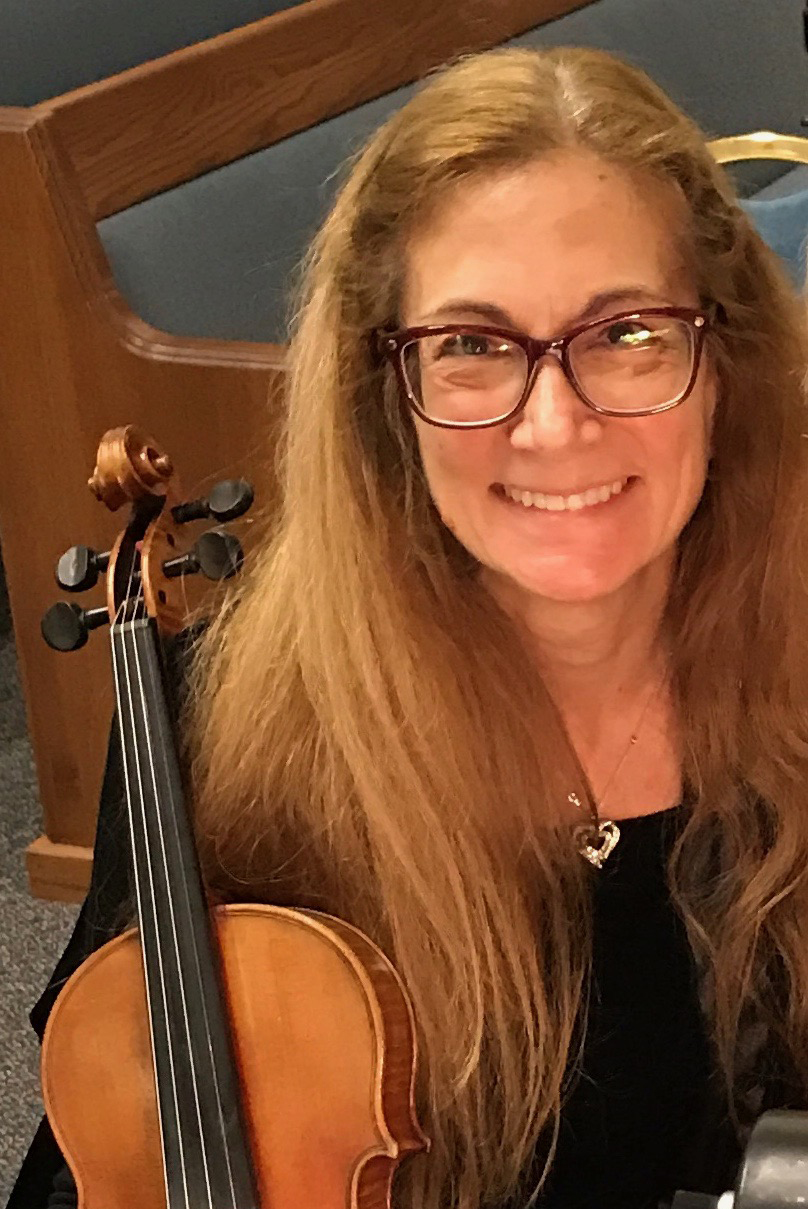Bess Knight holding a violin