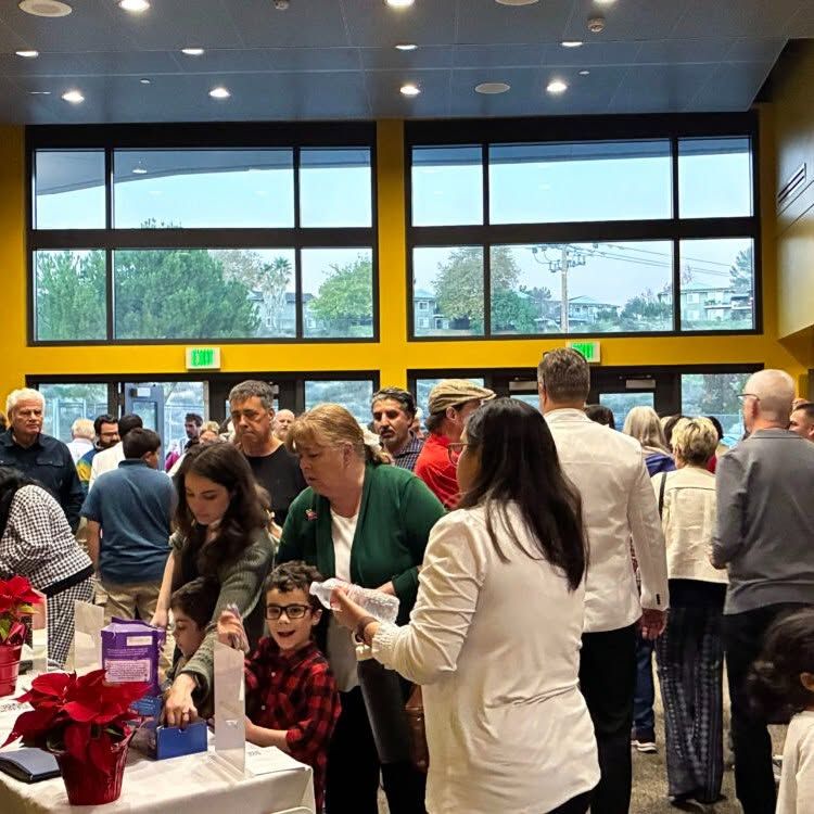 SCSO concertgoers of all ages gathering in the lobby before a holiday concert